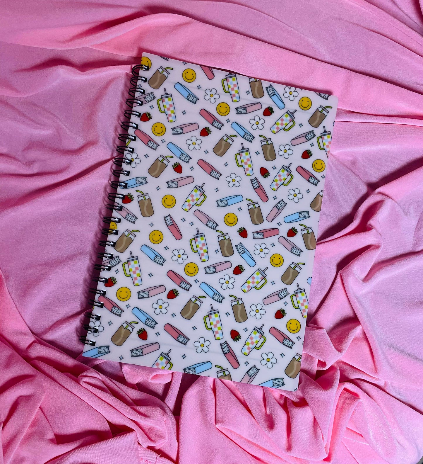 Books, iced coffee and smileys notebook