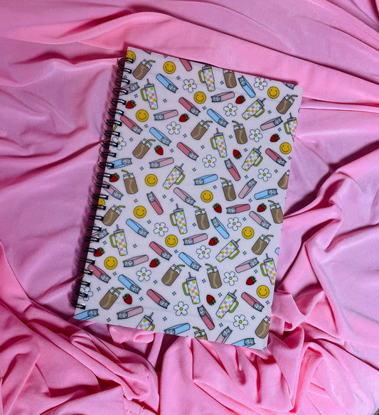 Books, iced coffee and smileys notebook