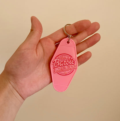 This *blonde girl* is a bookworm keychain